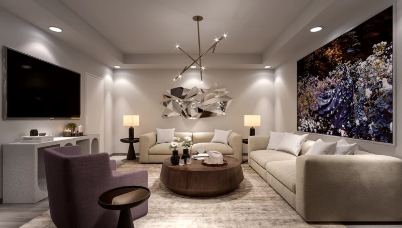Michael London Design: Home Lighting Design.This neutral living room has two neutral sofas, a purple armchair, a wood coffee table, a neutral rug that covers all the room, and a golden structure suspension chandelier.